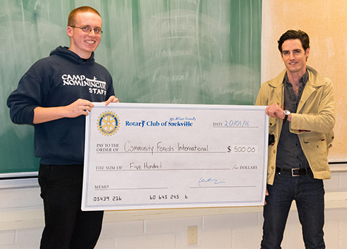 Then Mount Allison Rotaract president Colin Robertson presented a $500 cheque to Community Forest International founder Jeff Schnurr, 2016 (Sackville Rotary)